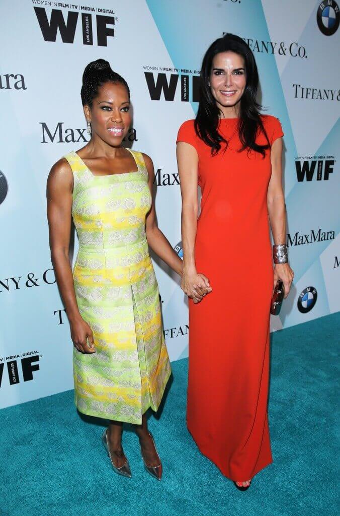 Actors Regina King (L) and Angie Harmon attend Women In Film 2015 Crystal + Lucy Awards Presented by Max Mara, BMW of North America, and Tiffany & Co. at the Hyatt Regency Century Plaza on June 16, 2015 in Century City, California