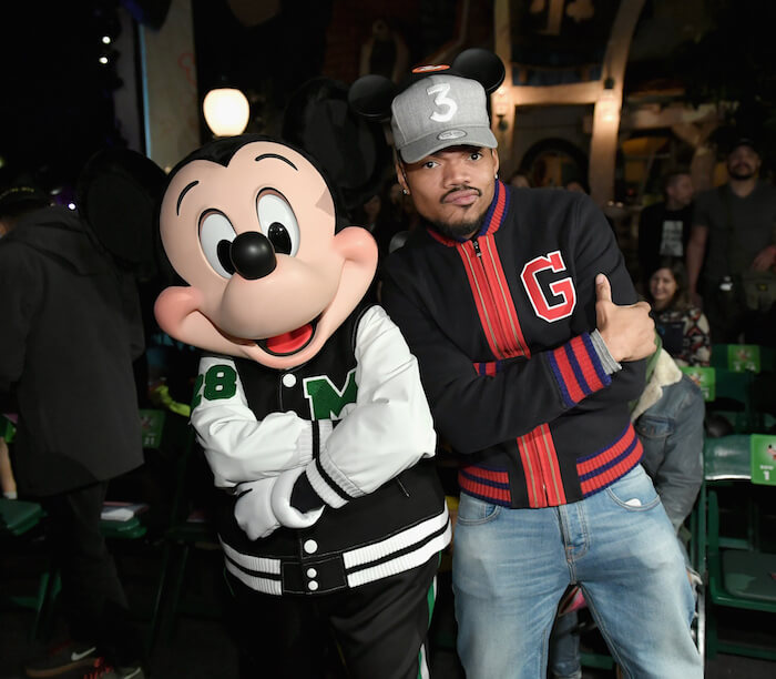 Mickey Mouse (L) and Chance The Rapper attend the launch of 